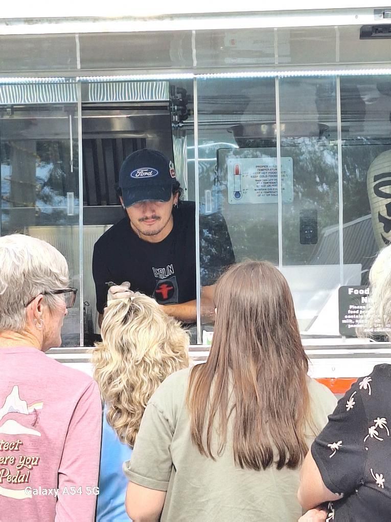 My son taking orders at Southern Lights Soft Opening August 30th, 2025